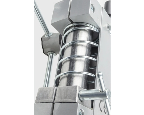 Detailaanzicht van een metalen pers met veer