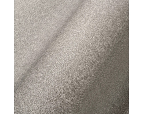 Close-up van grijs vliesbehang met fijne structuur