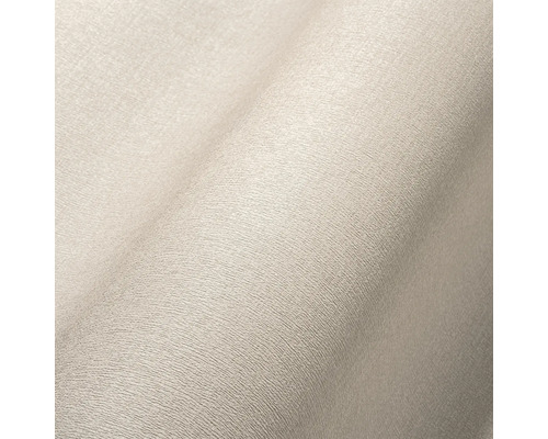 Close-up van een beige textielbehang met fijne structuur