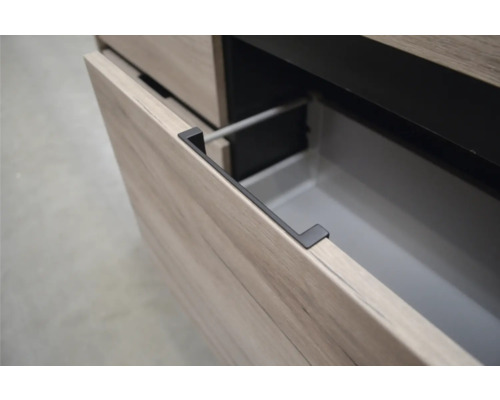 Detailopname van een open lade-element met greeplijst