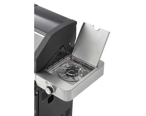 Detailopname van een gasbarbecue met zijbrander