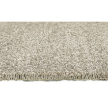 Close-up van een beige vloerkleed met hoogpolig