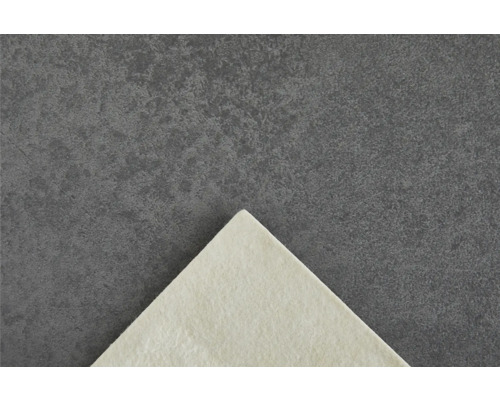 Detailweergave van een lichte vilten onderlegger op een donkere achtergrond