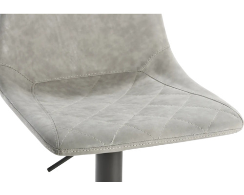 Detailopname van een barstoel met gestoffeerde bekleding