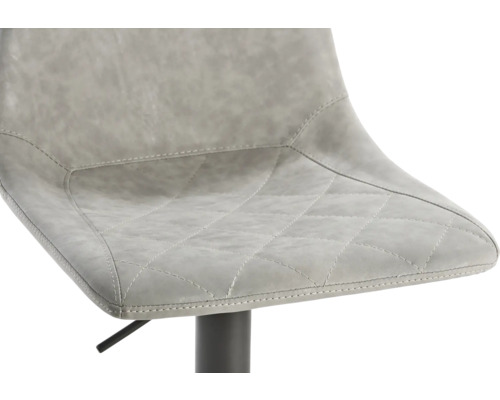 Gedetailleerde foto van een barkruk met kunstleren zitting