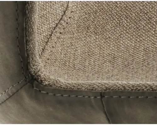 Detailopname van een meubelstuk met stoffen en lederen bekleding