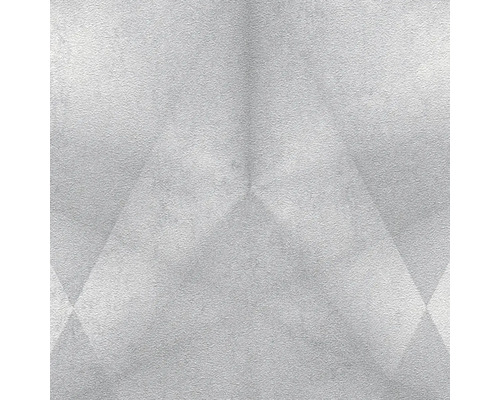 Close-up van een heldere wand met geometrische patronen.