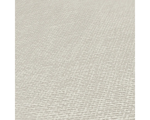 Close-up van een beige textielbehang met geweven structuur