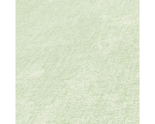 Close-up van een lichtgekleurd vliesbehang met een lichte textuur