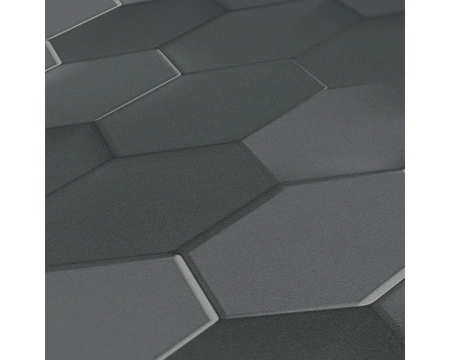 Close-up van een grijze muur met een zeshoekig patroon