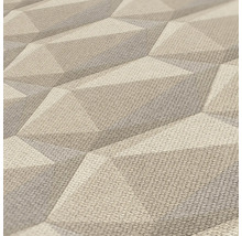 Close-up van een gestructureerd, driedimensionaal behang met geometrisch patroon.