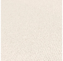 Close-up van een lichte textieloppervlakte met fijne structuur