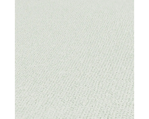 Close-up van een lichtgekleurd textielbehang met fijne structuur