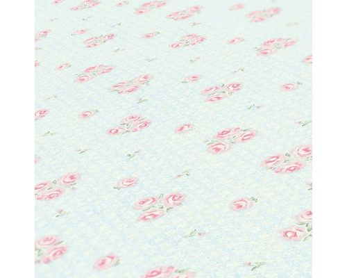 Close-up van een tafelkleed met rozenmotief