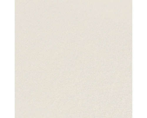 Close-up van een gestructureerd, lichtkleurig behang.