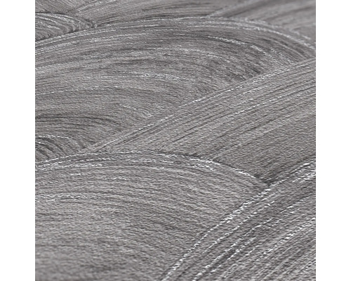 Close-up van een grijs vliesbehang met een golvende structuur