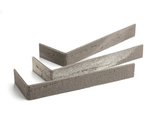 Drie betonnen muurafdekhoeken