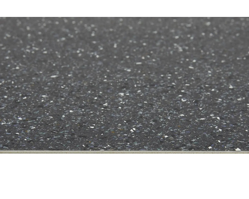 Close-up van een donker aanrechtblad met een gespikkeld oppervlak