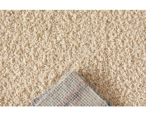 Close-up van een beige tapijt met pool