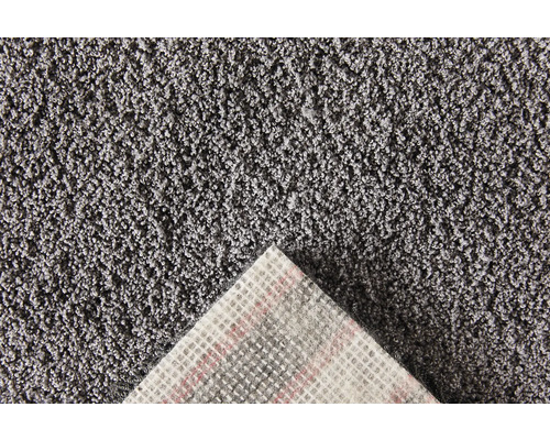 Close-up van een grijs tapijt met textielrug