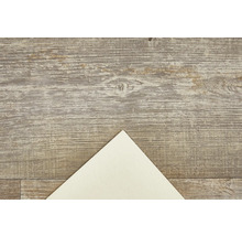 Houten vloer met patroon en vel papier
