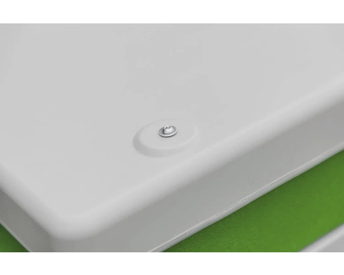 Detailopname van een wit oppervlak met schroef