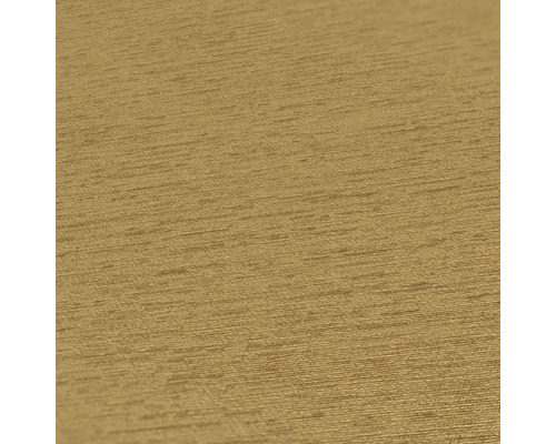 Close-up van een goudkleurig structuurbehang.