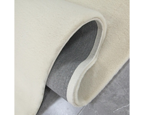 Detailweergave van een beige vloerkleed met pool