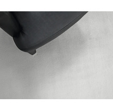 Detail van een meubelpoot met bekleding.