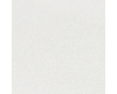 Close-up van een wit behang met een lichte structuur