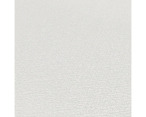 Close-up van een wit behang met lichte textuur