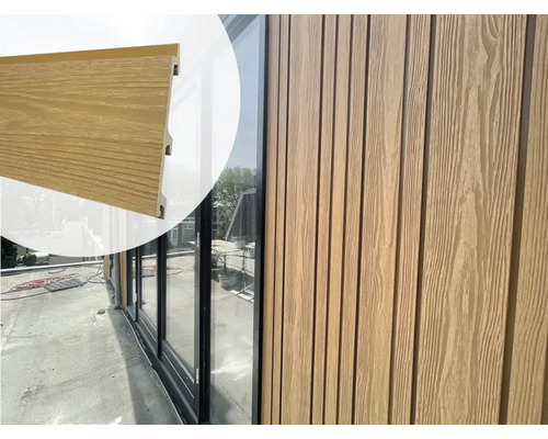 EVA-LAST Gevelbekleding Natural Cedar XL, 5900x152/163x24,5 mm Gevelbekleding met houtlook op een gebouw.