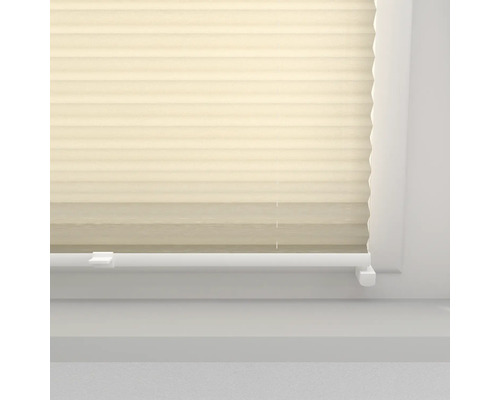 Detail van een plisségordijn op een raam