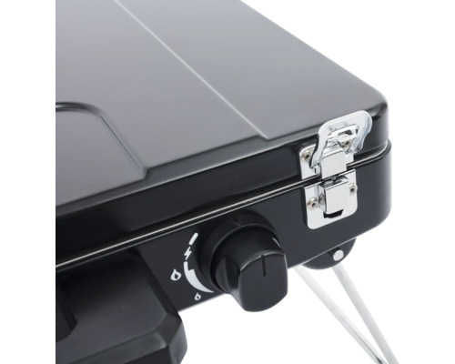 Detailopname van een zwart gasfornuis met regelaar en sluiting