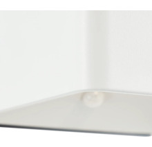 Detailopname van een witte lamp met een brandende gloeilamp