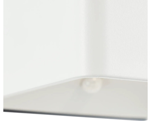 Detailopname van een witte lamp met een brandende gloeilamp