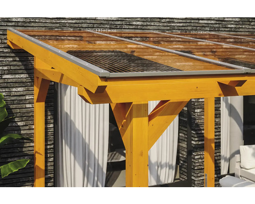 Detailopname van een houten tuinpaviljoen met een transparant dak