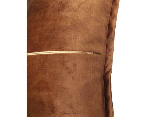 Detailopname van een bruin sierkussen met ritssluiting