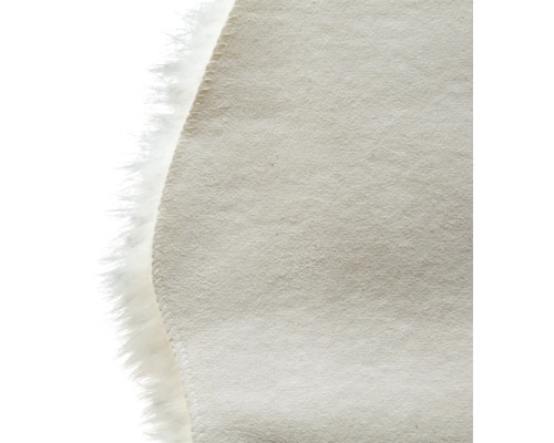 Detailweergave van een rond tapijt met een rand van imitatiebont