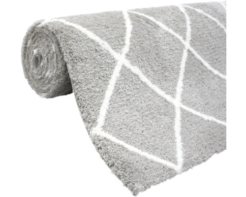 Opgedroogd grijs vloerkleed met wit ruitpatroon