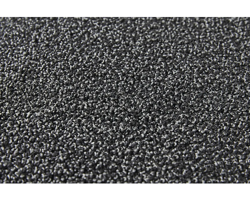 Close-up van een antracietkleurig tapijt met lussenstructuur