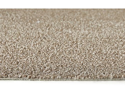 Close-up van een beige tapijt.