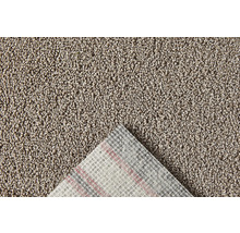Close-up van een beige tapijt met textielrug