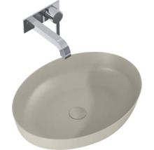 Wastafel van keramiek met wandkraan