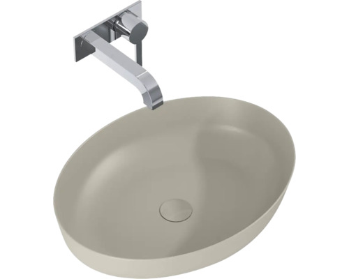 Wastafel van keramiek met wandkraan