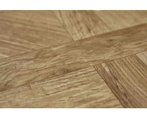 Close-up van laminaatvloer in visgraatmotief