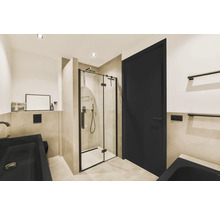Badkamer met douche, wastafel en deur in een modern design.
