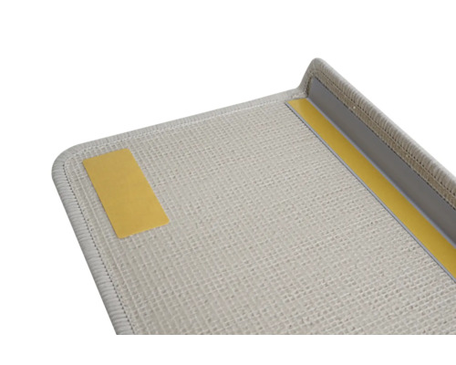 Detailweergave van een lichte deurmat met plakstrips voor bevestiging