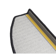 Uitsnede van een deurmat met rugcoating en textieloppervlak