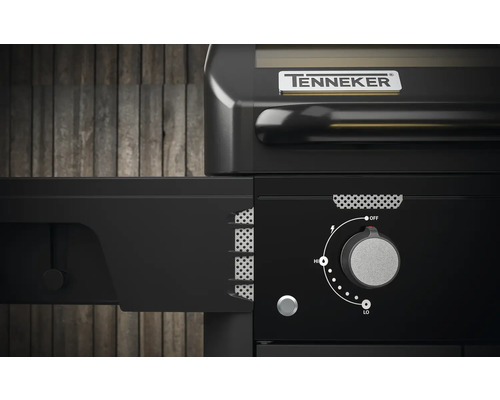 Detailweergave van een zwarte Tenneker gasbarbecue met draaiknop voor temperatuurregeling.